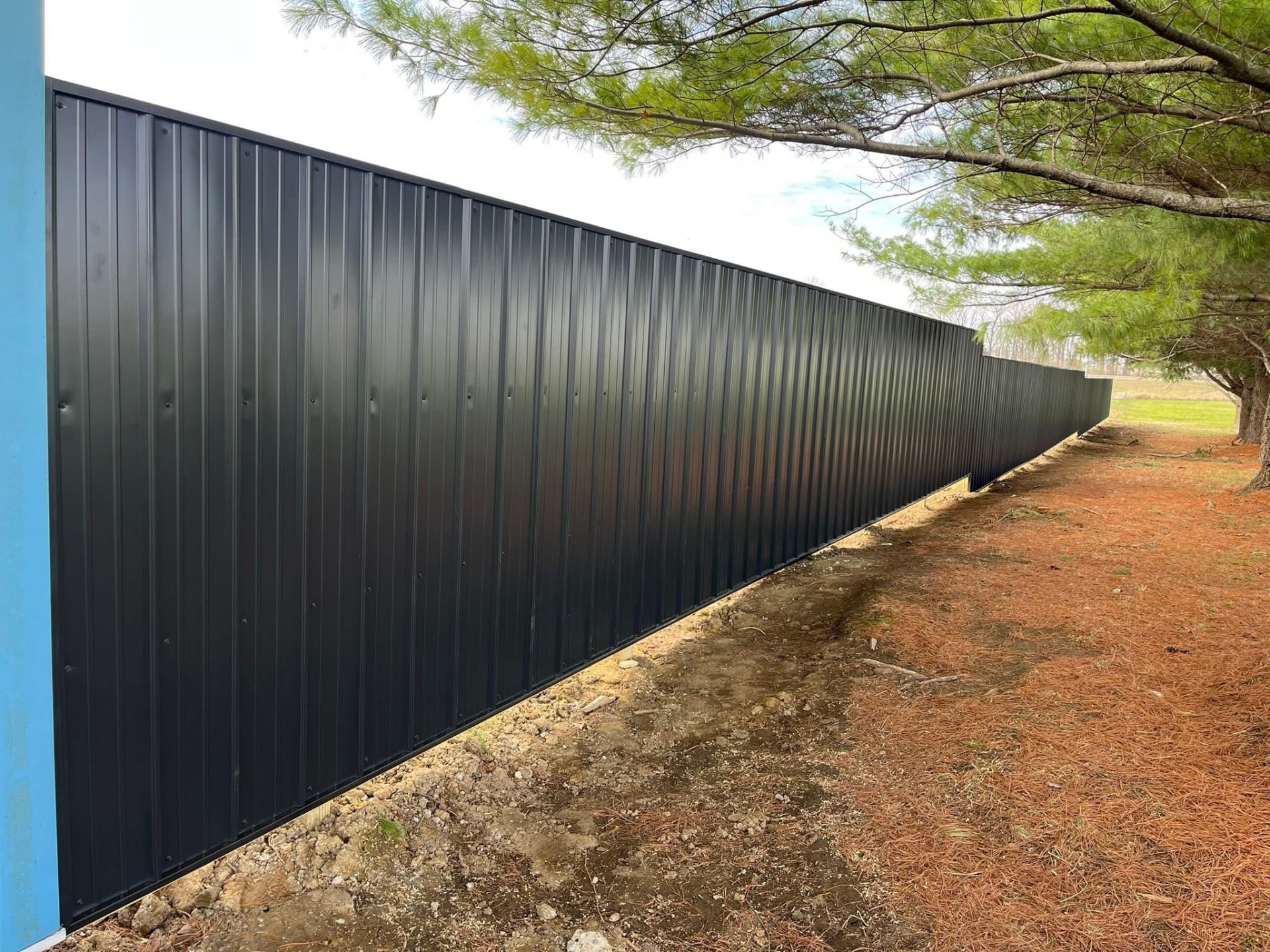 Black metal privacy panel fence